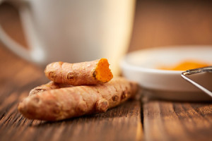 70342770 - tumeric curcuma root healthy golden orange powder