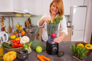 50763936 - woman blending vegetables
